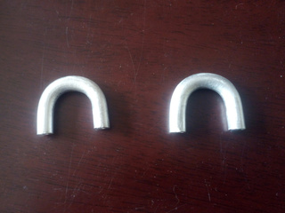 A pair of finished U shaped handles